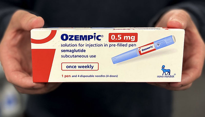 Man holding ozempic 